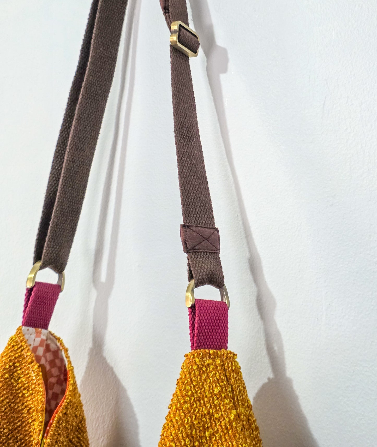brown straps and pink ends on a white background