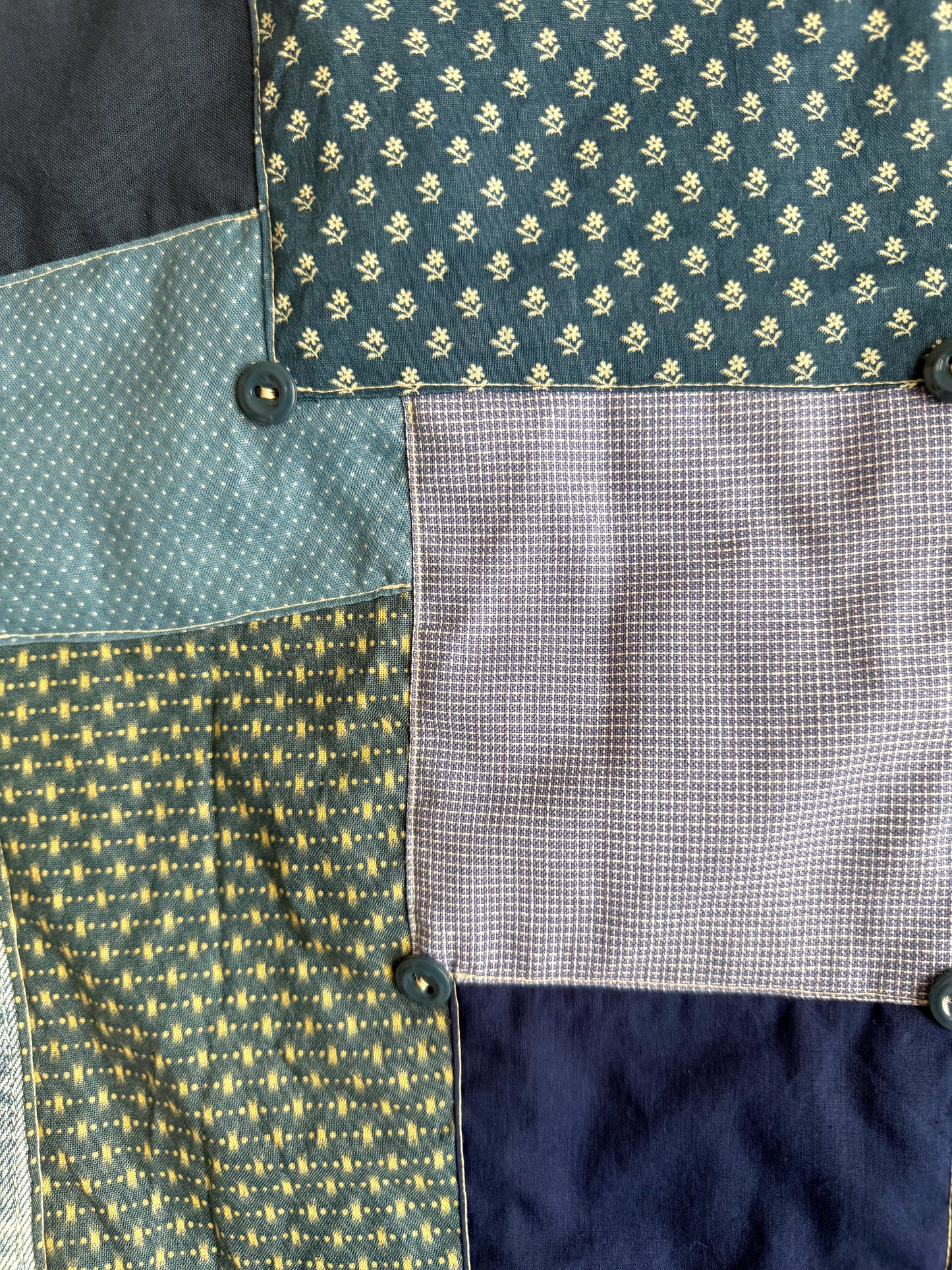 Close-up of fabric with various patterns and colors.